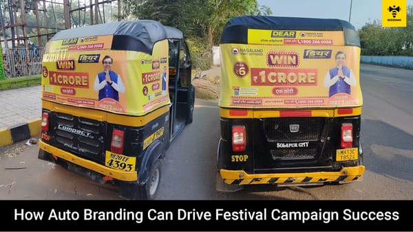 Festive-themed auto rickshaw with vibrant branding on city streets.