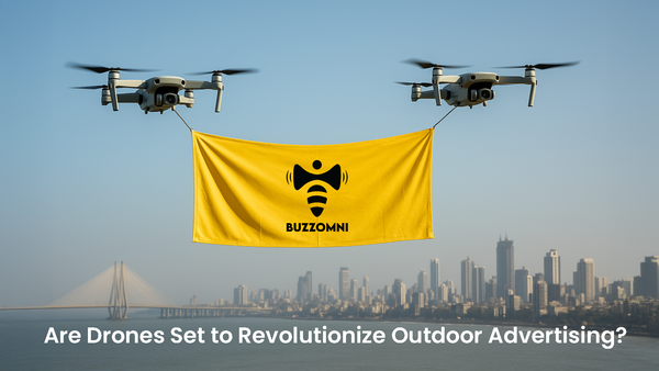 Two drones flying in the sky holding a banner, demonstrating a creative approach to outdoor advertising tracked by BuzzOmni.